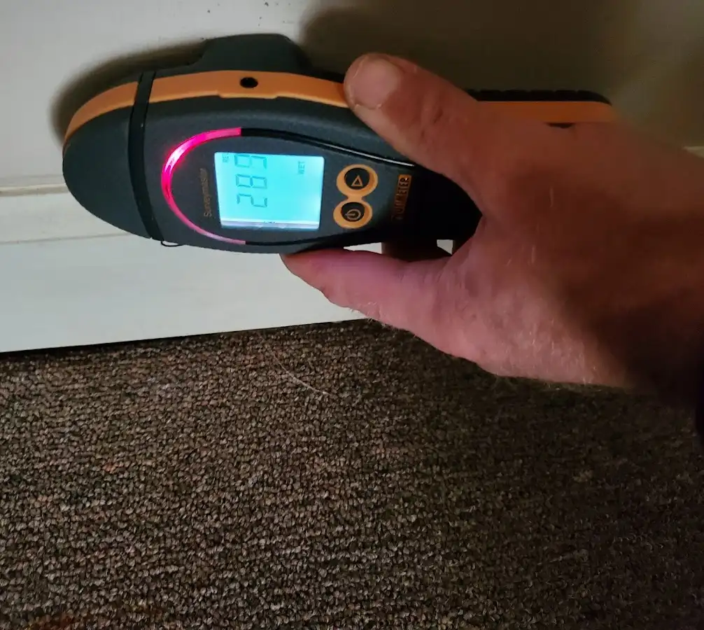 Moisture detection at baseboard during Storm Damage Restoration in Price